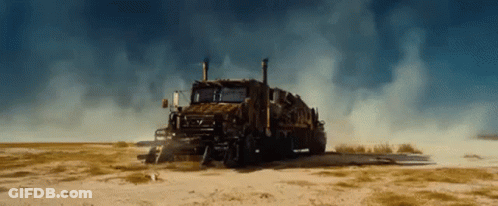 Large Truck Parked In Dirt Field GIF