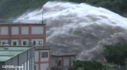 Large Waterfall Flowing Down Building GIF