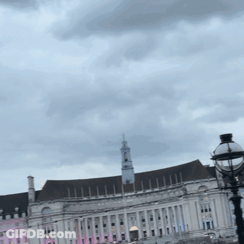Large White Building With Clock Tower GIF