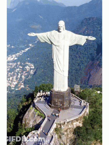 Large White Jesus Statue On Hill GIF