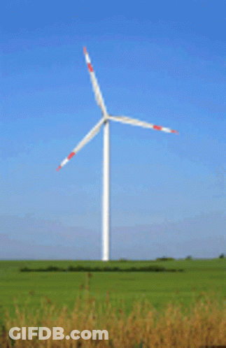 Large Wind Turbine In Grassy Field GIF