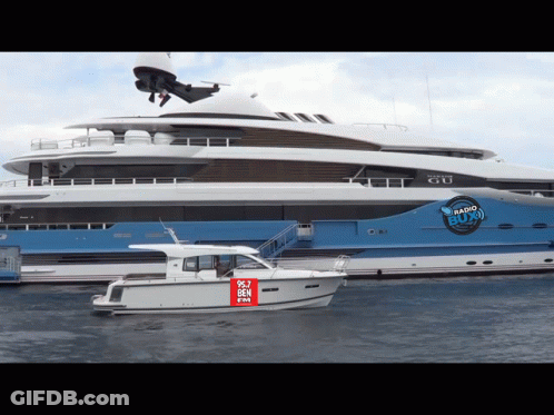Large Yacht With Boat Saying 90.7 Ben GIF