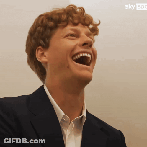 Laughing Man In Suit With Sky Logo GIF