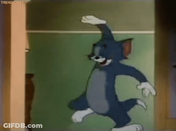 Laughing Tom Cat Hitting His Knee GIF