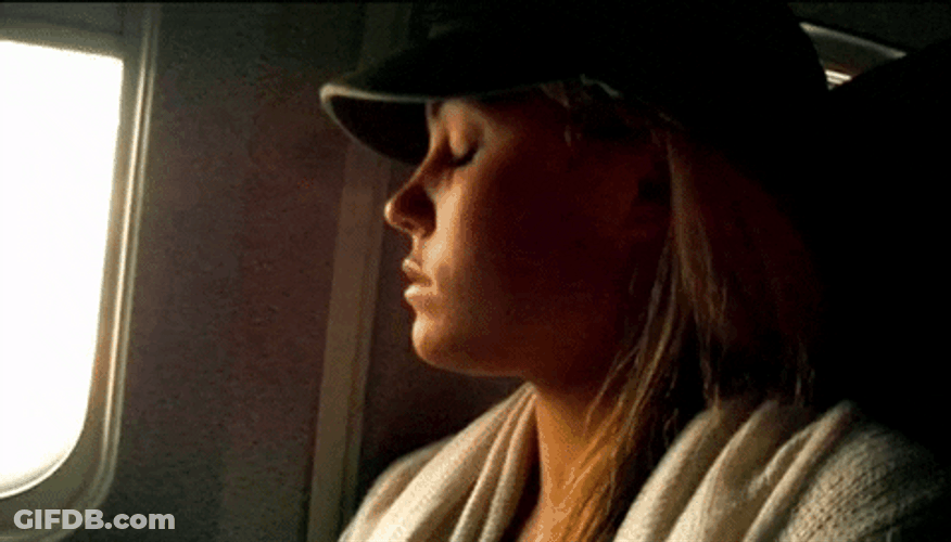 Lauren Waking Up On Plane GIF