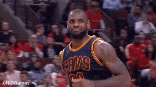 Lebron James Is A Basketball Player For The Cavs And Is Standing In Front Of A Crowd . GIF