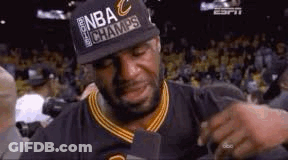 Lebron James Is Crying While Wearing A Hat And Holding A Microphone . GIF