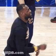 Lebron James Is Kneeling Down On The Court During A Game . GIF