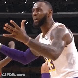 Lebron James Is Making A Funny Face While Playing Basketball In A Game . GIF