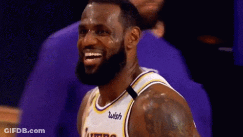 Lebron James Is Smiling While Wearing A Lakers Jersey . GIF
