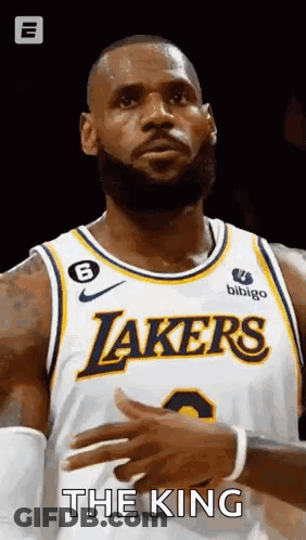 Lebron James Is Wearing A Lakers Jersey And Clapping His Hands During A Game . GIF