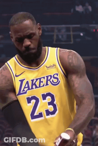 Lebron James Is Wearing A Lakers Jersey With The Number 23 On It GIF