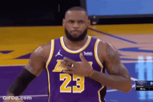 Lebron James Is Wearing A Purple Jersey With The Number 23 On It And Giving A Thumbs Up . GIF