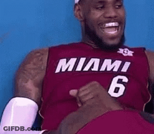 Lebron James Is Wearing A Red Miami Jersey And Laughing . GIF