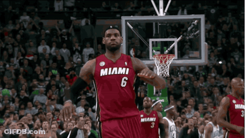 Lebron James Is Wearing A Red Miami Jersey During A Basketball Game GIF
