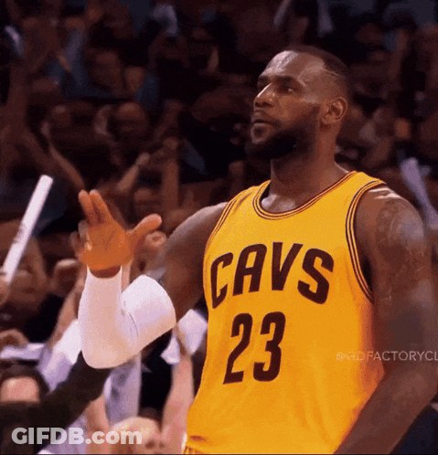 Lebron James Is Wearing A Yellow Jersey With Cavs 23 On It GIF