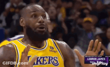 Lebron James Is Wearing A Yellow Lakers Jersey And Making A Funny Face . GIF