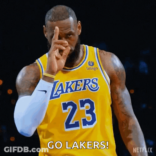 Lebron James Is Wearing A Yellow Lakers Jersey And Pointing At The Camera . GIF