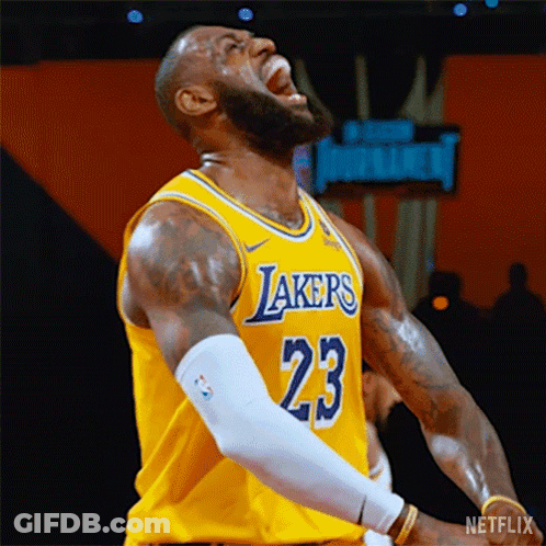 Lebron James Is Wearing A Yellow Lakers Jersey And Screaming During A Basketball Game . GIF
