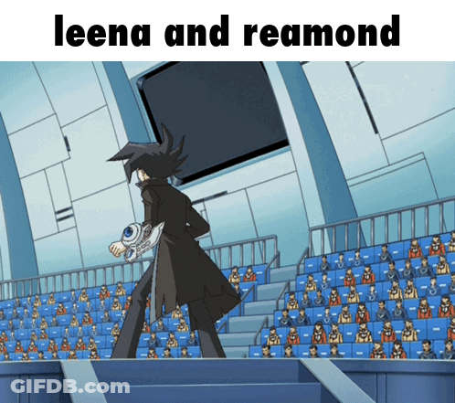 Leena And Reamond Standing In Front Of Crowd GIF