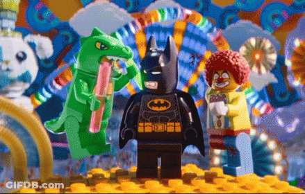 Lego Batman In Front Of Clown And Green Dinosaur GIF