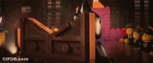 Lego Batman Standing Next To Pink Brick GIF