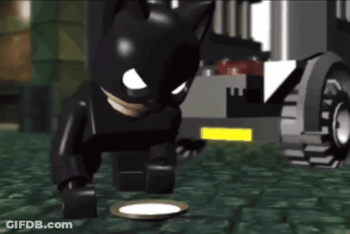 Lego Batman Standing Next To Plate GIF