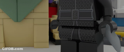 Lego Figure In Front Of Brick Wall GIF