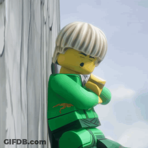 Lego Figure Leaning Against Wooden Wall GIF