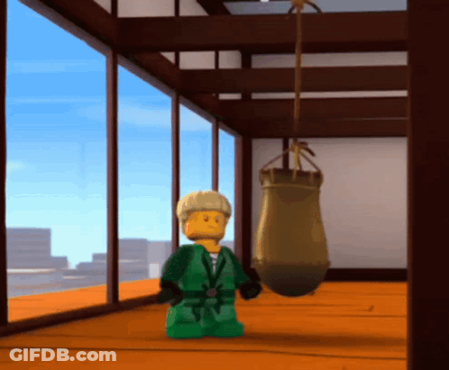 Lego Figure Standing In Front Of Punching Bag GIF