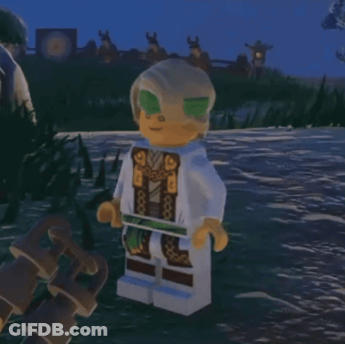 Lego Figure Standing In Grass With Sword GIF