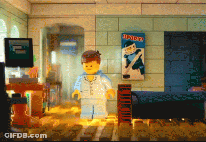Lego Figure Standing In Room With Sports Poster GIF
