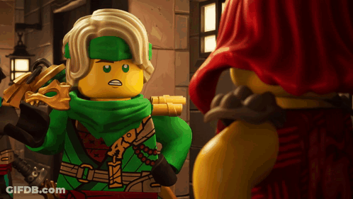 Lego Figure With Green Scarf Next To Another Lego Figure GIF