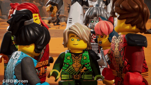 Lego Figures Gathered Around Boy In Green Vest GIF