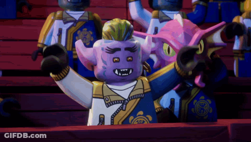 Lego Figures Sitting In Stadium Including Purple Figure With Horns GIF
