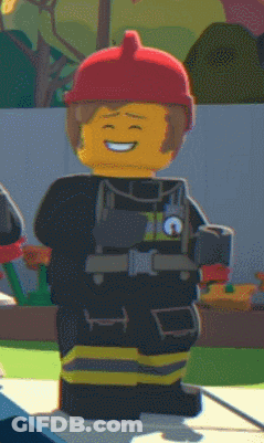 Lego Fireman Smiling In Red Helmet And Vest GIF