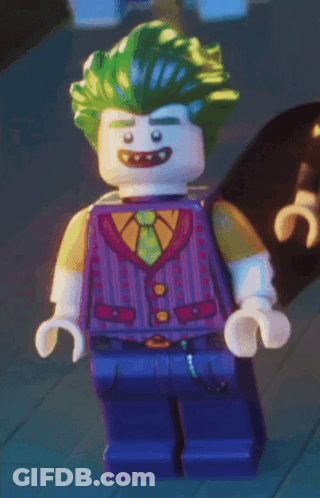 Lego Joker Smiling In Purple Vest And Tie GIF