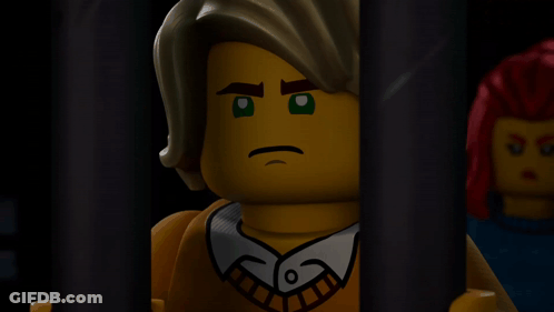 Lego Man Behind Bars Serious Look GIF