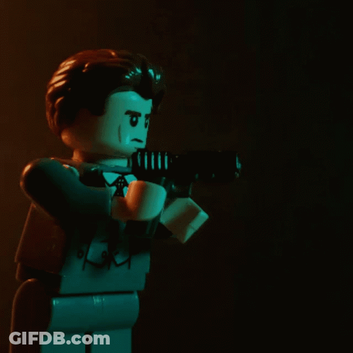 Lego Man Holding Gun With White Arrow GIF