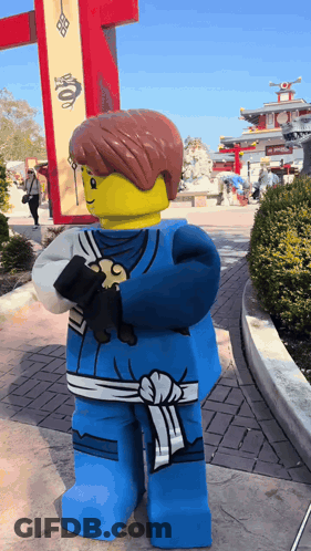 Lego Ninjago Character Beside Dragon Sign GIF