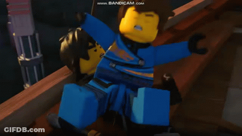 Lego Ninjago Character Holding Glowing Green Swords GIF