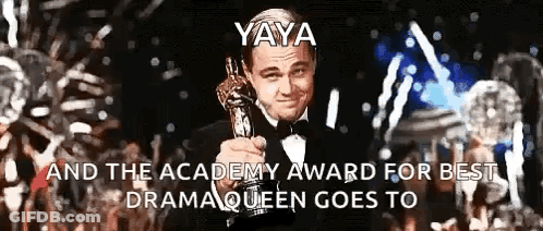 Leonardo Dicaprio Is Holding An Oscar Trophy In Front Of A Crowd Of People GIF