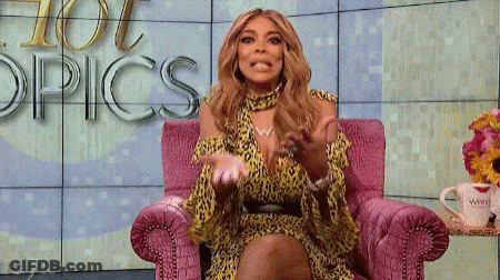 Leopard Print Woman In Pink Chair By Hot Topics Wall GIF