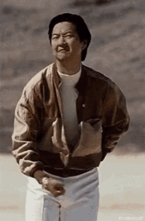 Leslie Chow Throwing Something Gesture GIF