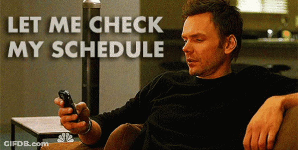 Let Me Check My Schedule Man Holding Phone GIF