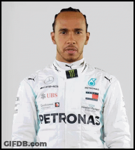 Lewis Hamilton Is Wearing A White Jacket With Logos For Ubs And Petronas GIF