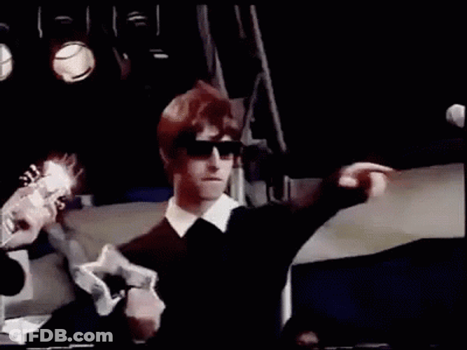Liam Gallagher Shaking Tambourine GIF