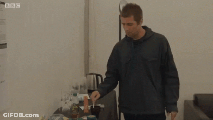 Liam Gallagher Stirring Cup Of Drink GIF