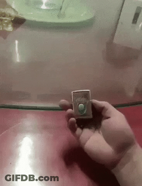 Lighting Hands Using Lighter To Light Table GIF