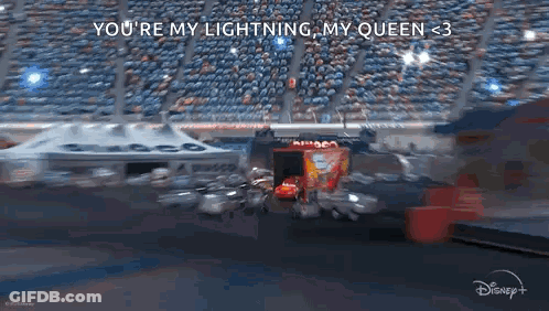 Lightning Mcqueen Is Driving A Race Car On A Race Track In Cars 3 . GIF